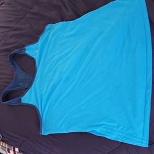 Racer back tank top with pull strings on sides to keep shirt from riding up.